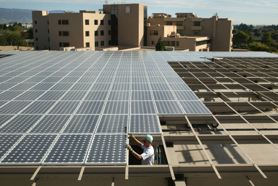 A worker installs a solar panel on the Downing Resource Center at Salinas Valley Memorial Hospital. (PRNewsFoto/Salinas Valley Memorial Healthcare System )