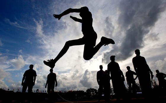 A disabled officer of Sri Lankan army participates in long-jump event during an athletic competition for disabled soldiers in Diyagama, suburbs of Colombo, Sri Lanka, Tuesday, Aug 14, 2012. Tens of thousands of soldiers were wounded in a quarter-century civil war between government troops and separatist Tamil Tiger rebels which ended in 2009 after Sri Lankan soldiers crushed the rebels. (AP Photo/Gemunu Amarasinghe)